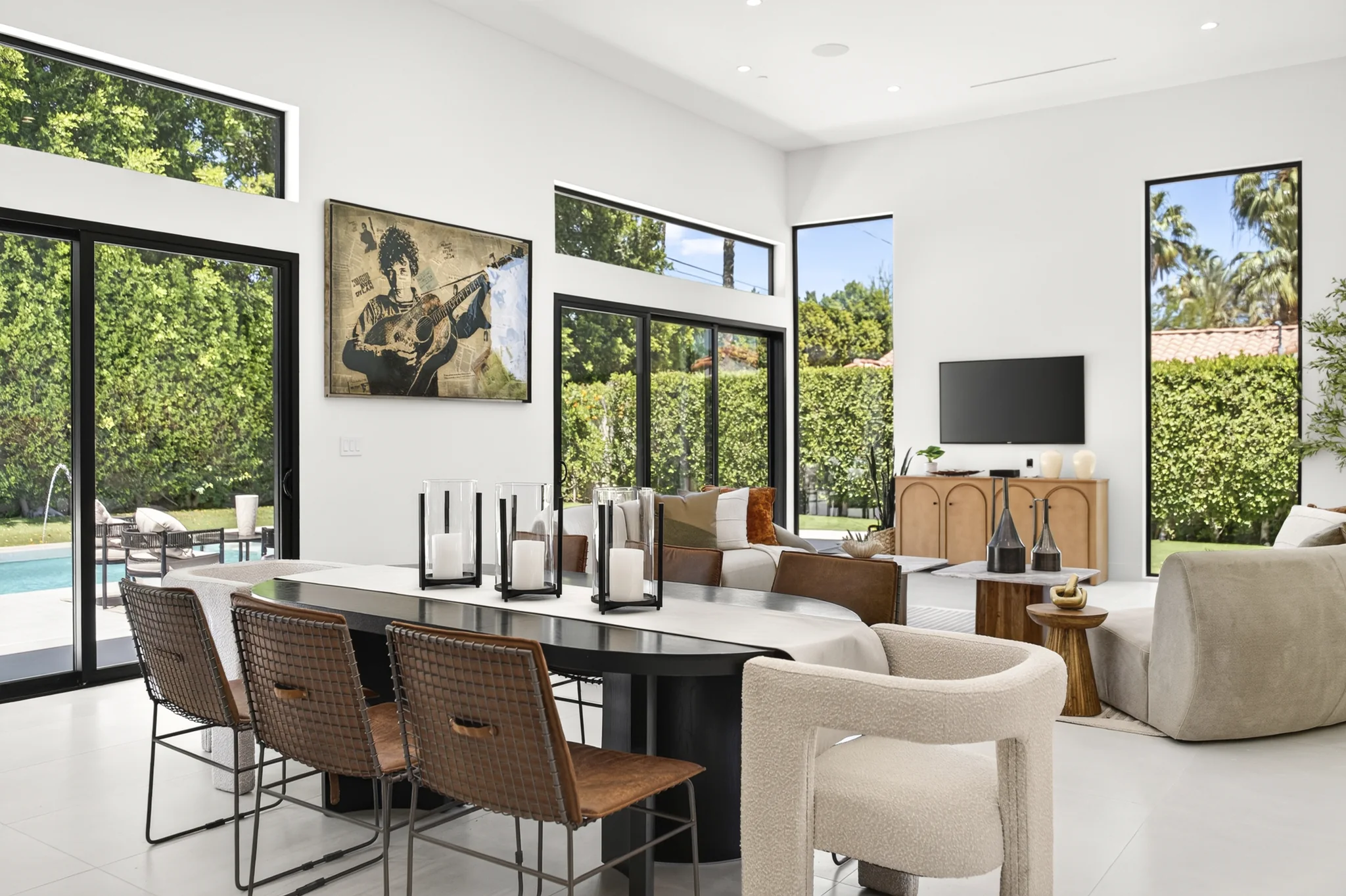 Alameda: dining table beside floor-to-ceiling garden windows