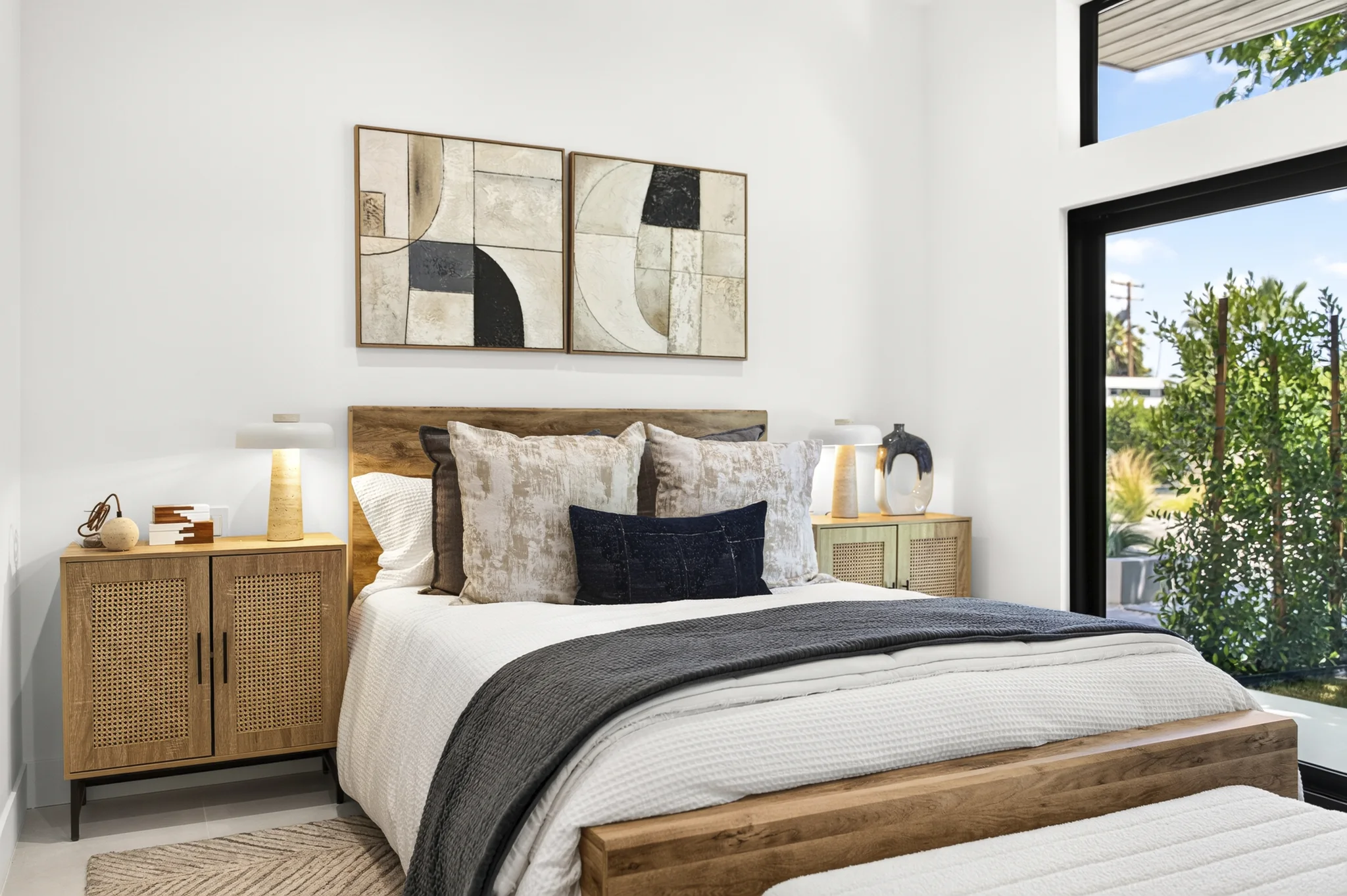 Alameda: bedroom with timber storage and framed artwork