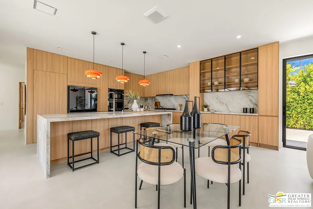 Amado: timber kitchen with a stone island and pendant lights