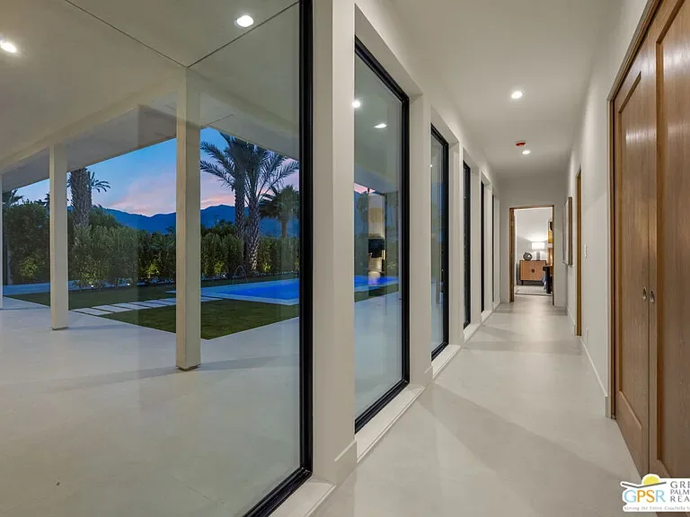 Amado: glazed hallway overlooking the illuminated pool
