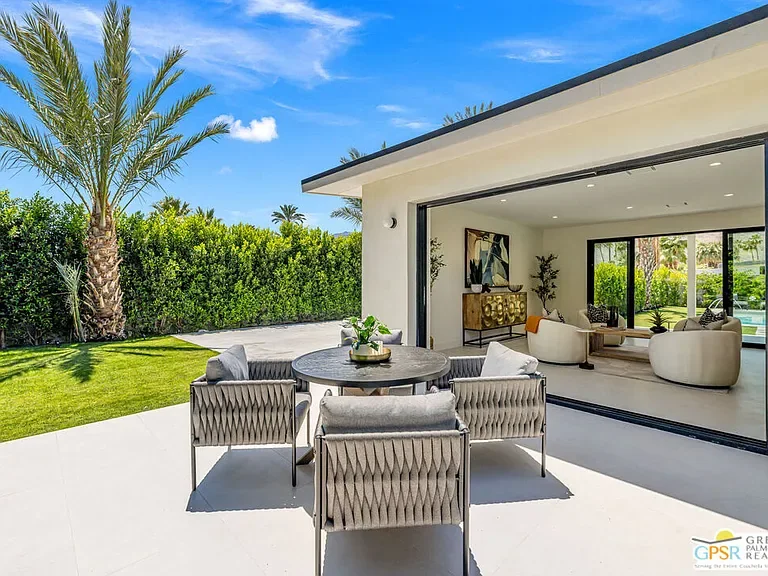 Amado: covered outdoor seating beside the house