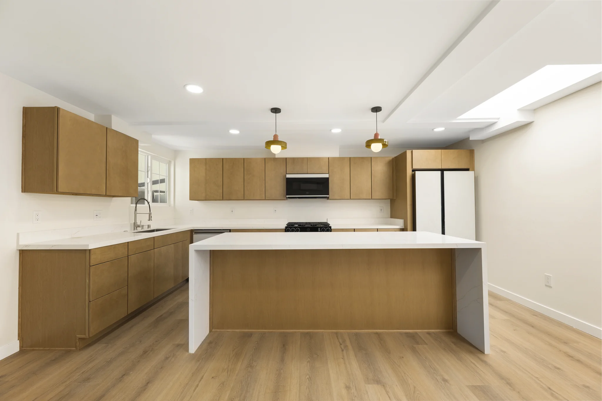 Sherbourne: open kitchen with a timber island and pendant lights