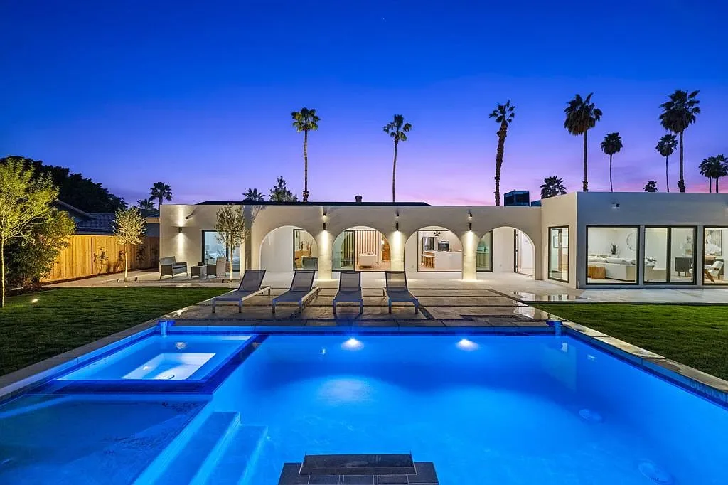 Vista Grande: pool courtyard and arched terrace illuminated at dusk