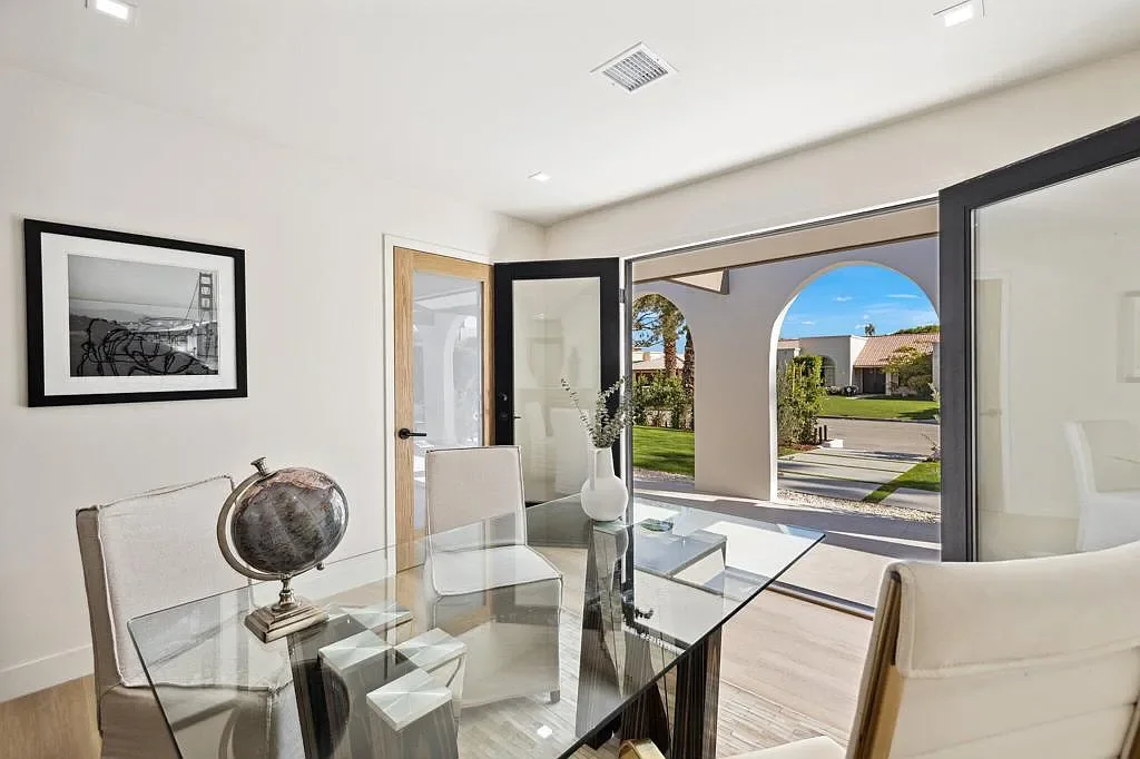 Vista Grande: dining area framed by an arched opening
