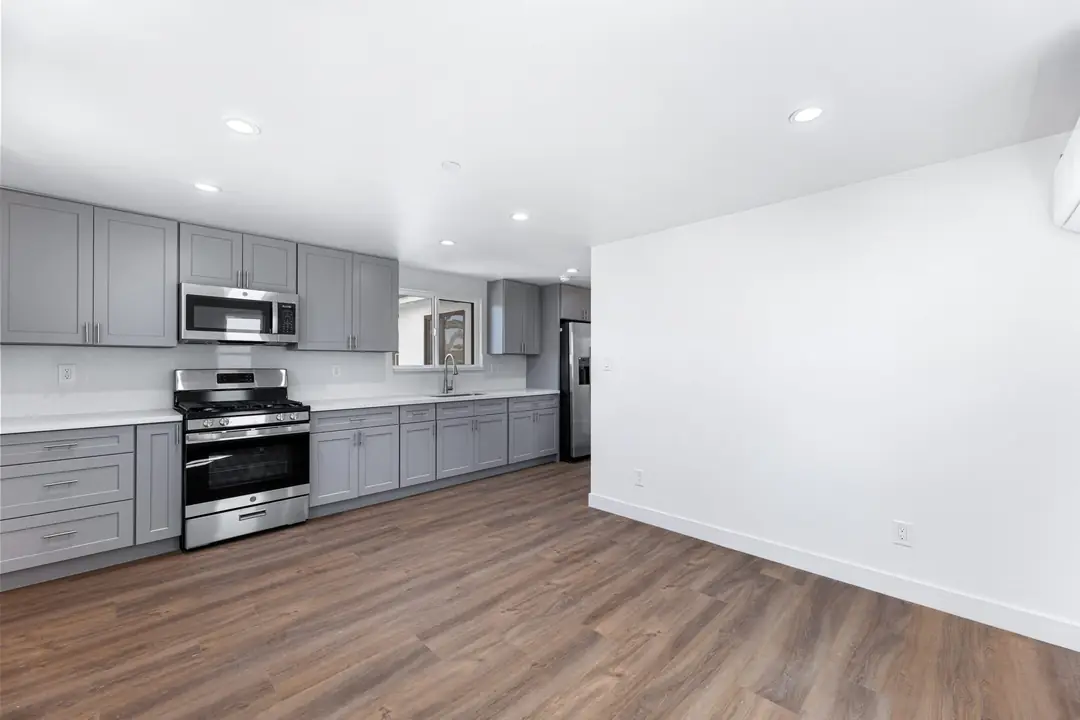 Cimarron: kitchen and living area with wood toned floors