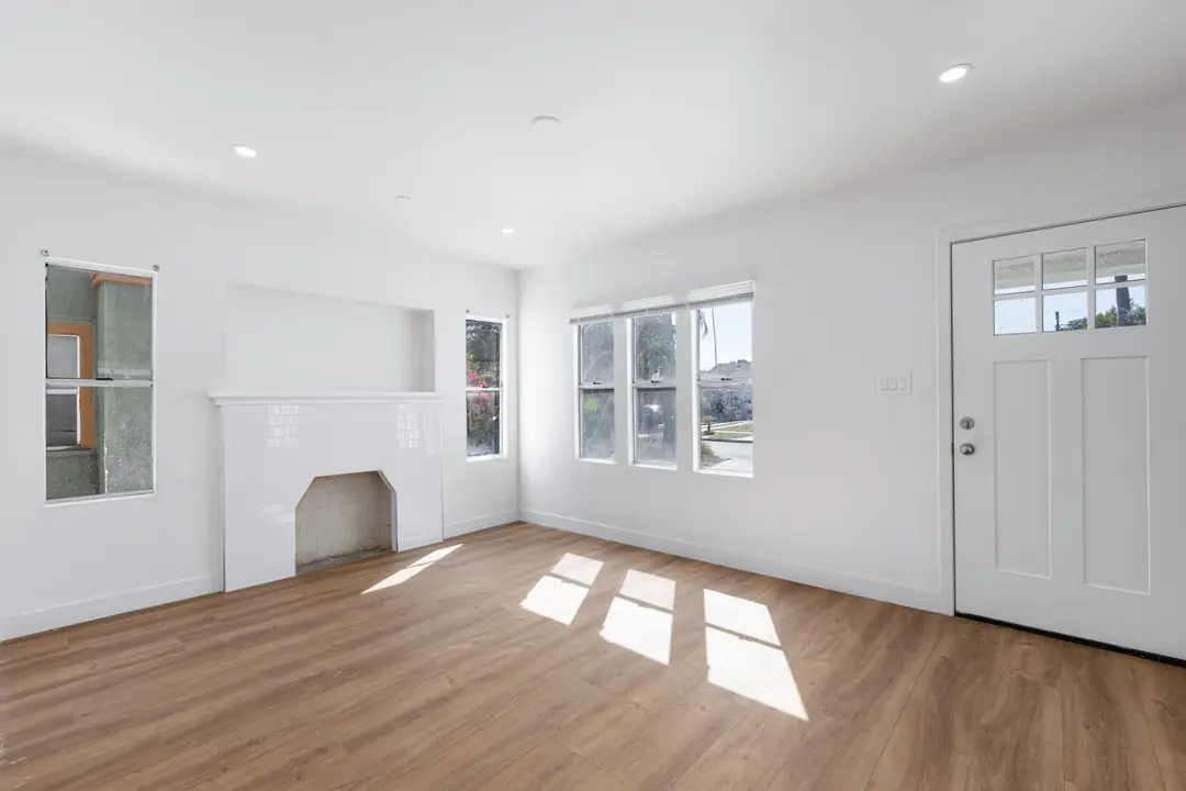 Cimarron: living room with broad windows and fireplace opening
