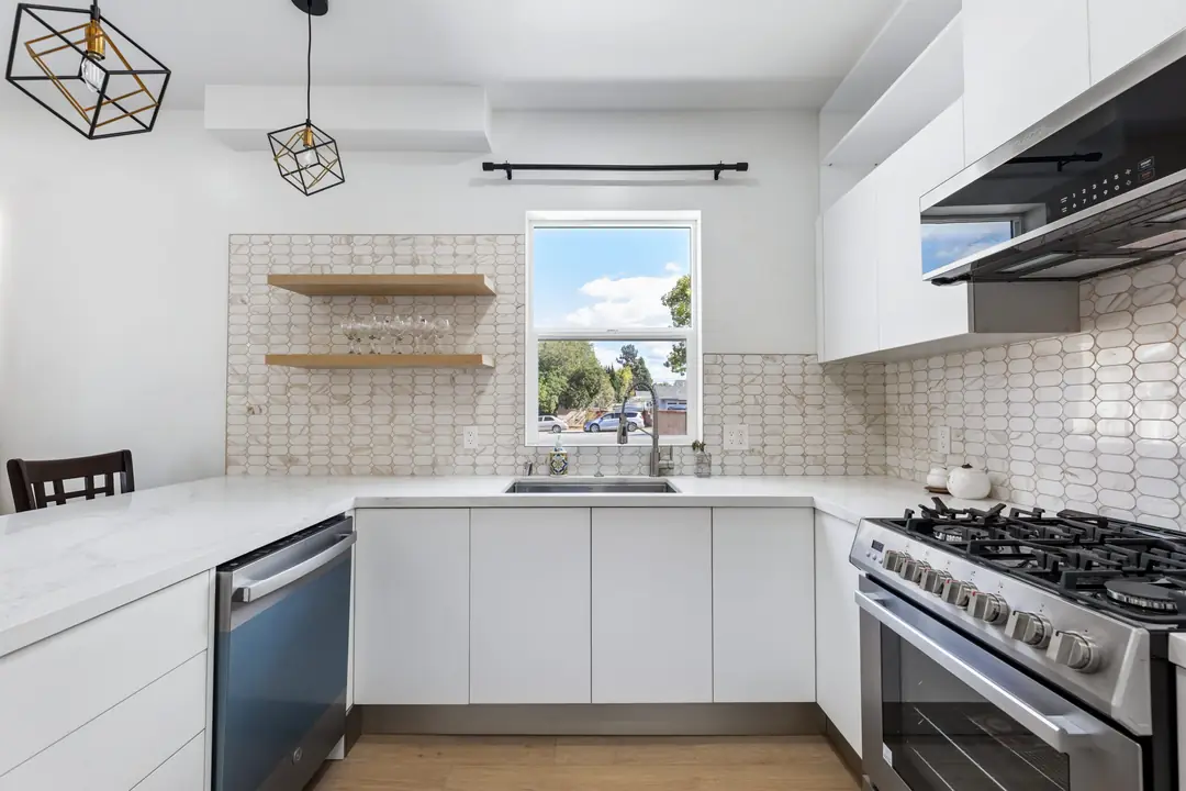Lancewood: kitchen sink beneath window and open shelves