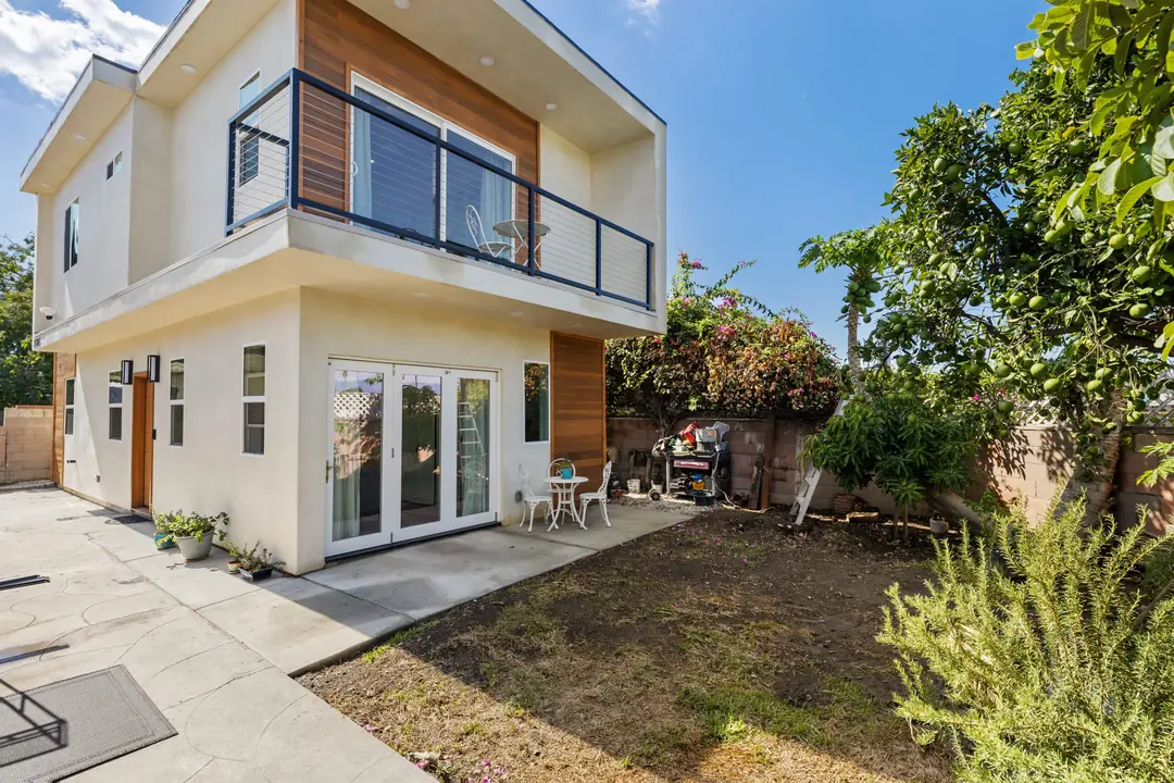 Lancewood: balcony and patio viewed from the garden