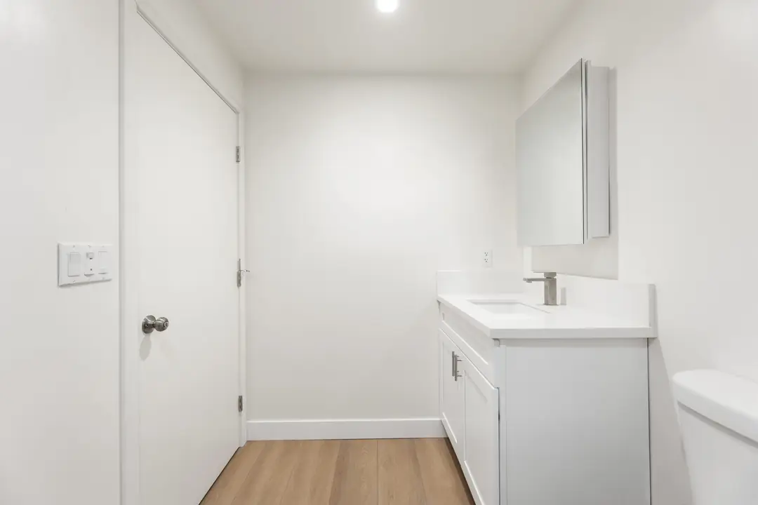Linden: bathroom vanity beside a closed door