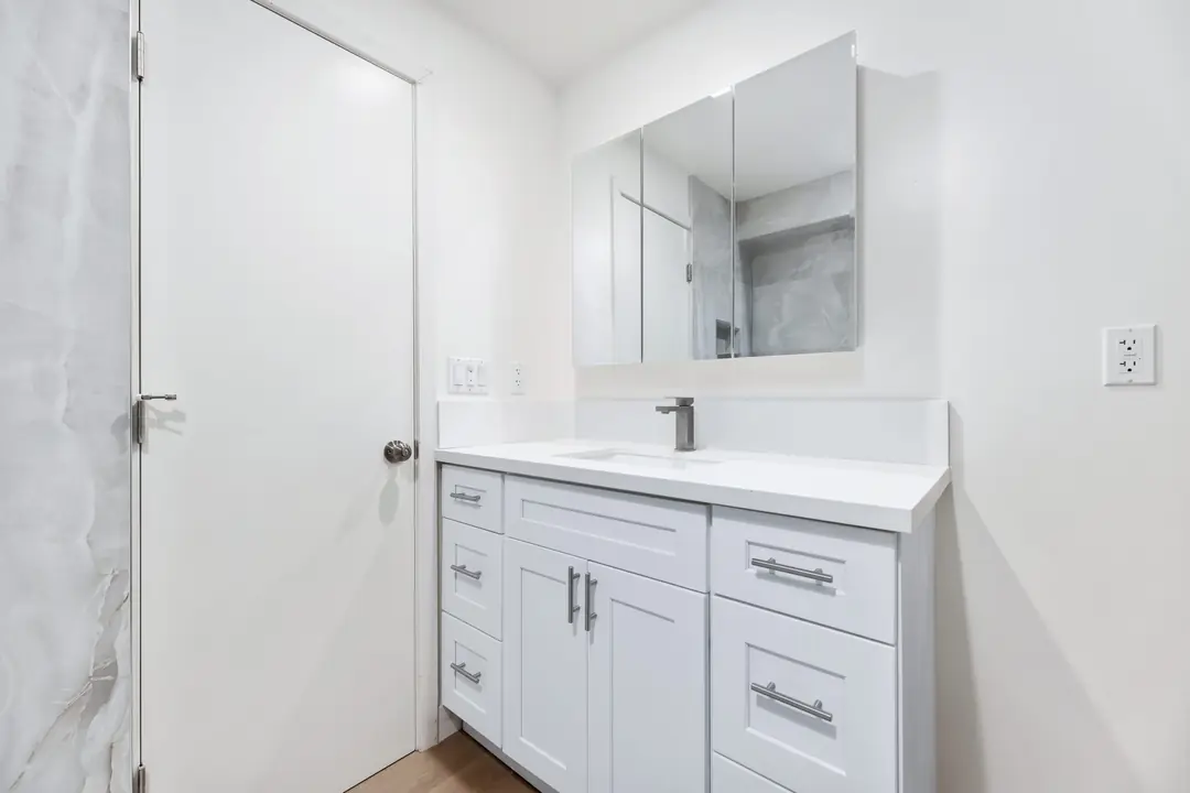 Linden: white bathroom vanity and wide mirror