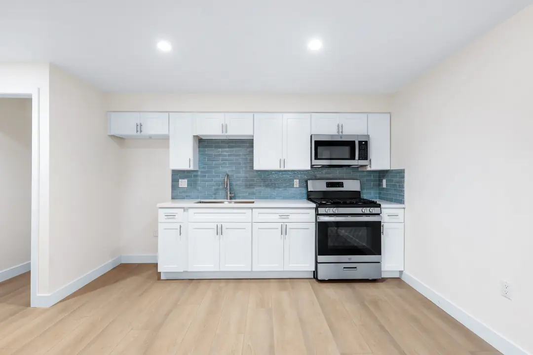 Linden: compact kitchen with blue green backsplash