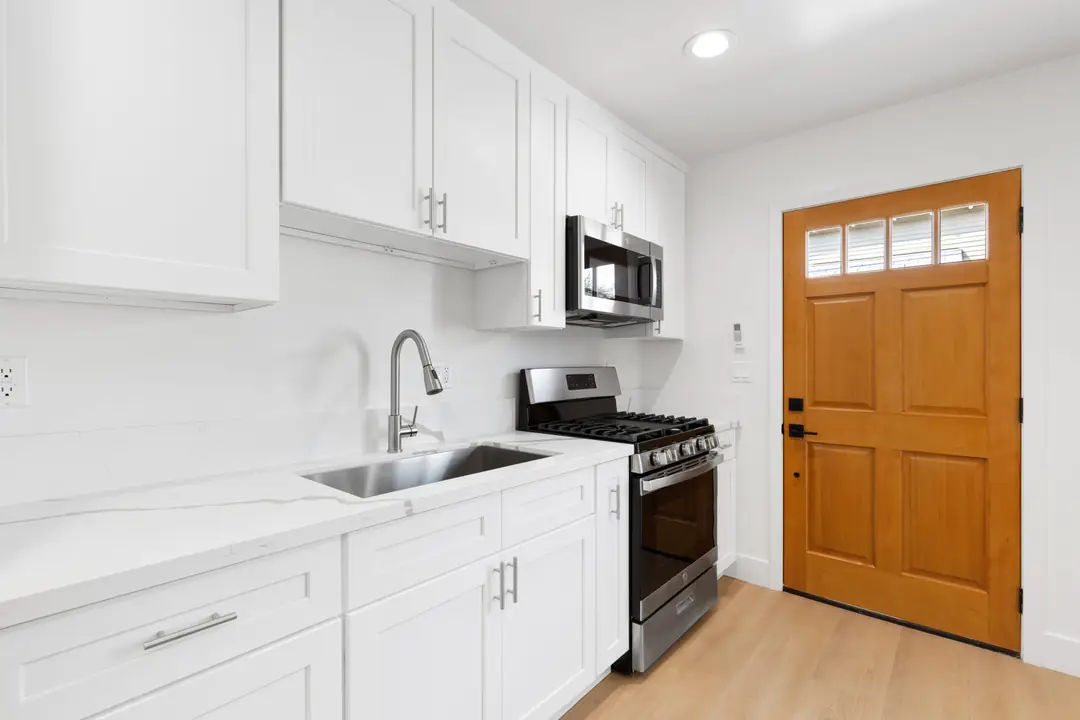 Magnolia: kitchen counter beside entry