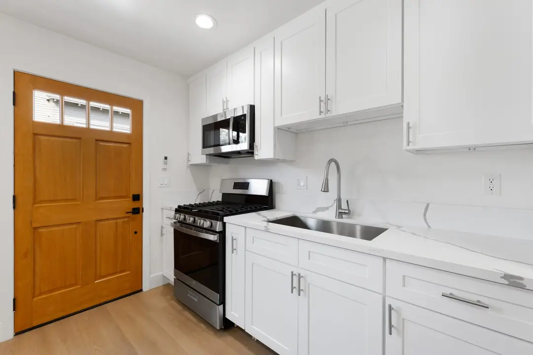 Magnolia: white kitchen counter and cabinets