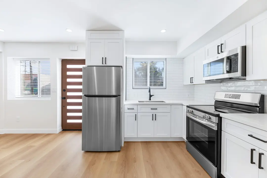 Molino: white kitchen with stainless appliances
