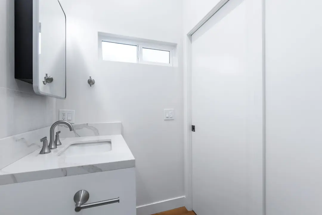 Ocean: bathroom vanity below high window