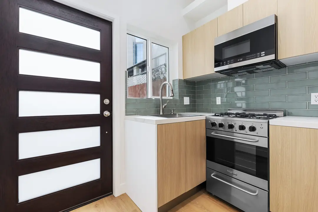 Ocean: kitchen fittings beside glazed door