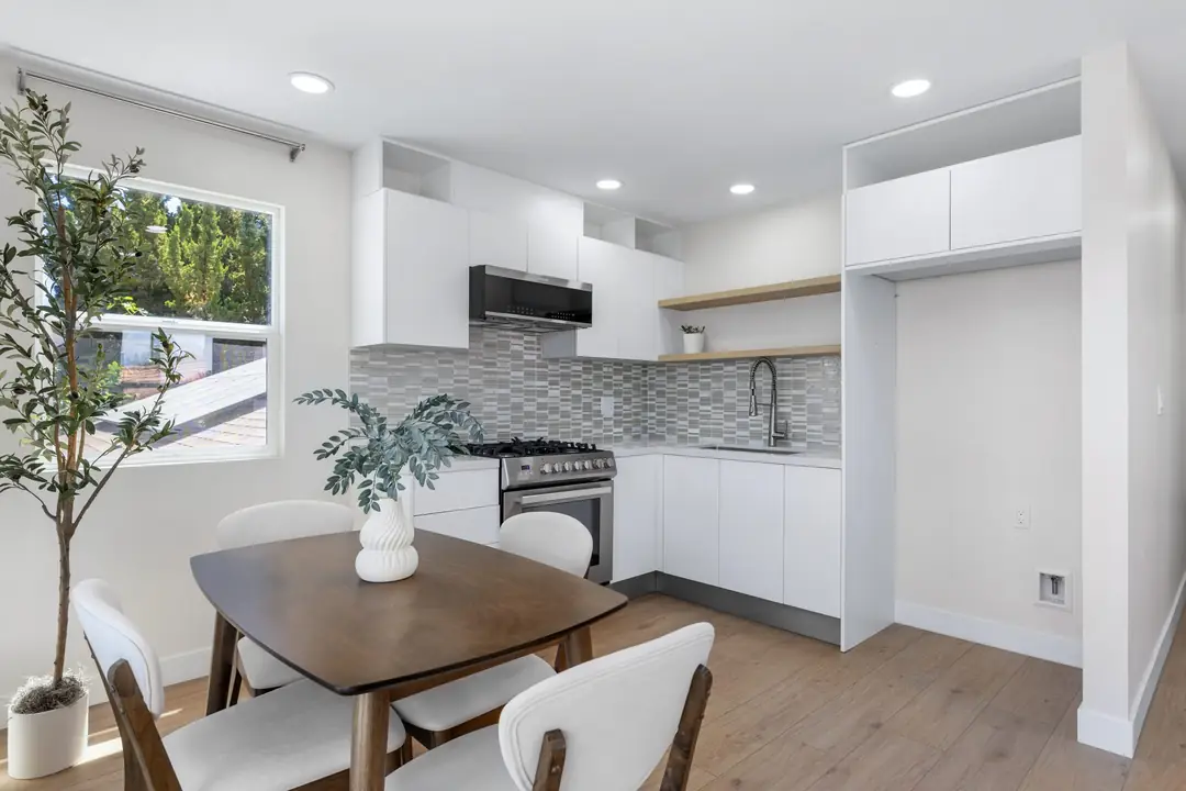 Paso Verde: dining table beside compact kitchen