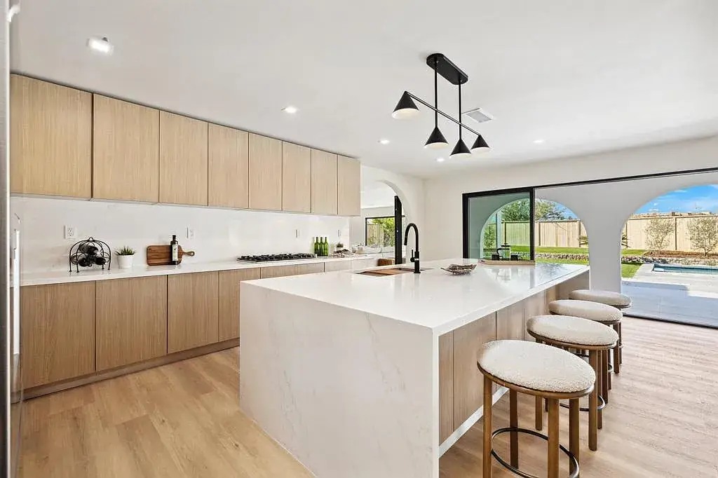 Vista Grande: kitchen island with wood toned cabinetry