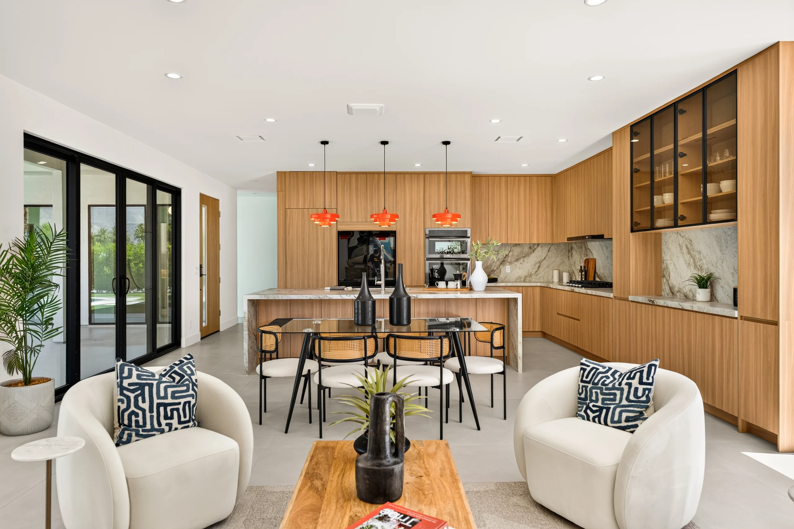Amado: open living area and timber kitchen beside sliding garden doors